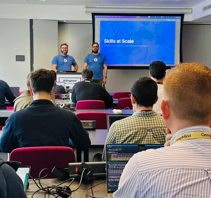 Nick and Zack presenting Skills at Scale to a room of attendees at AIE Europe